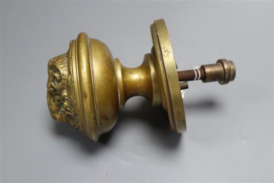 A 19th century brass rams mask door handle, depth 18cm